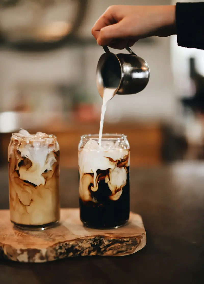 Barista pouring coffee